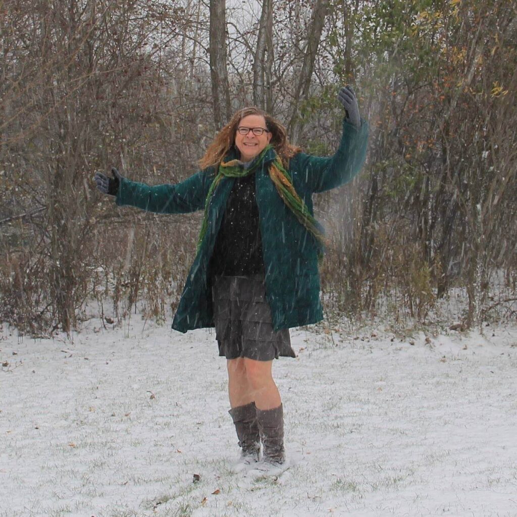 Deena Larsen enjoying a forest snowfall